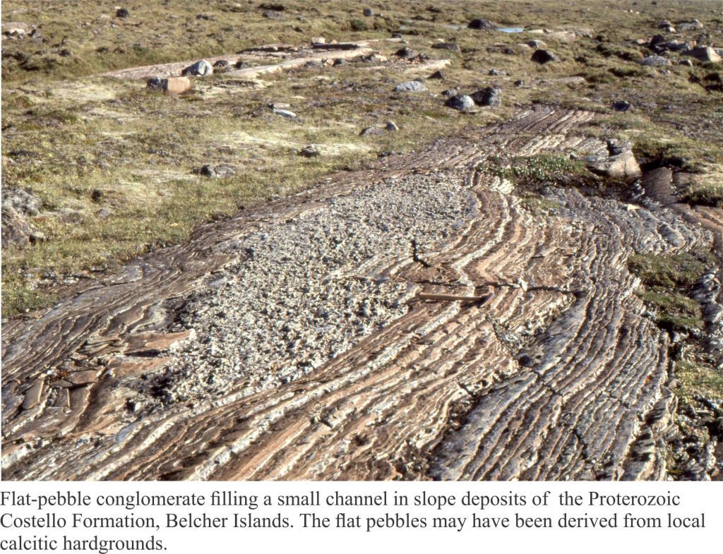 Small slope channel filled with slabs of ripped-up calcareous mudstone and hardground
