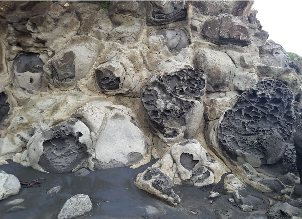 Exfoliation of spheroidally weathered rock rinds in Pliocene Basalt, NZ