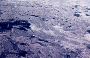 Raised gravel beach ridges resulting from glacio-isostatic rebound following melting of the Laurentide Icesheet. Belcher Islands. The distance between the yellow dots is 500 m. Modern beach is on the left.