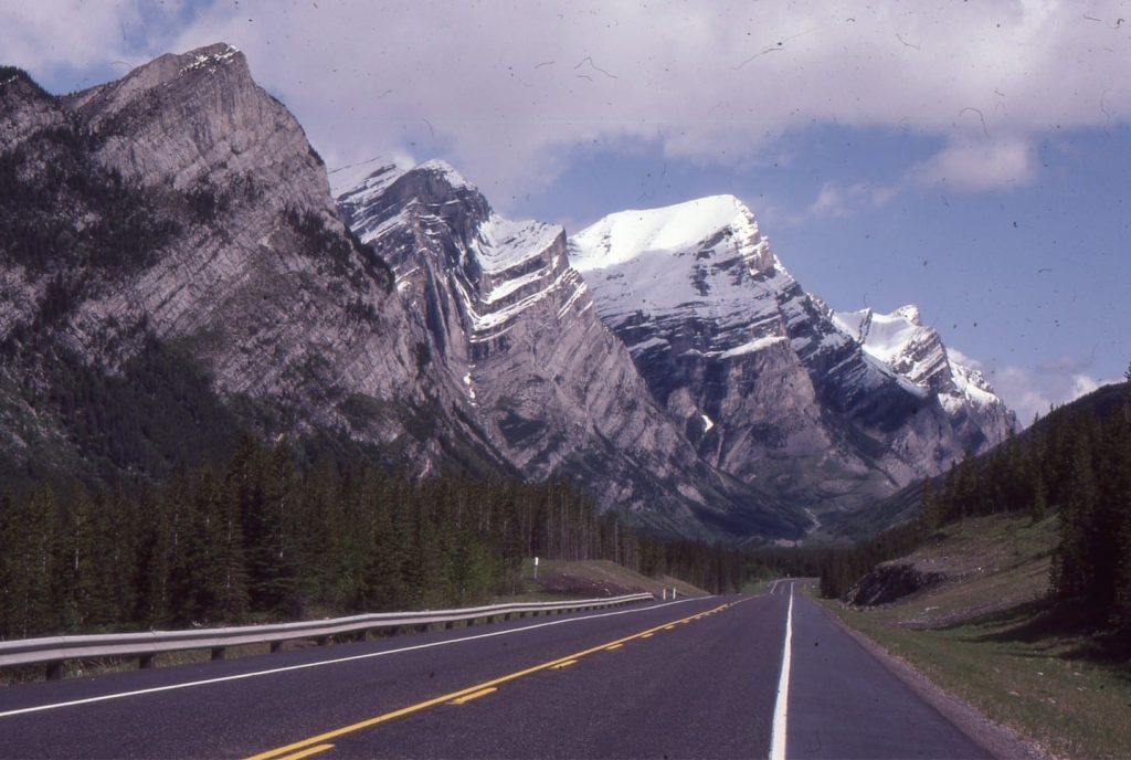 Part of the Alberta Front Ranges fold and thrust belt that acted as a tectonic load, promoting crustal flexure and formation of Alberta foreland basin. Here, the trace of Lewis Thrust runs parallel to Kananaskis Highway, with the fold pair in Lower Paleozoic carbonates in the hanging wall; Lewis Thrust terminates at the base of this fold pair.
