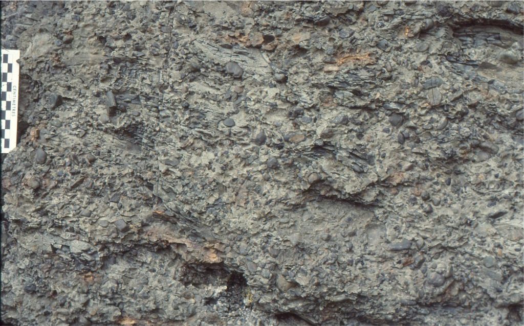 Pebbly mudstone having textural characteristics of a cohesive, viscous debris flow.