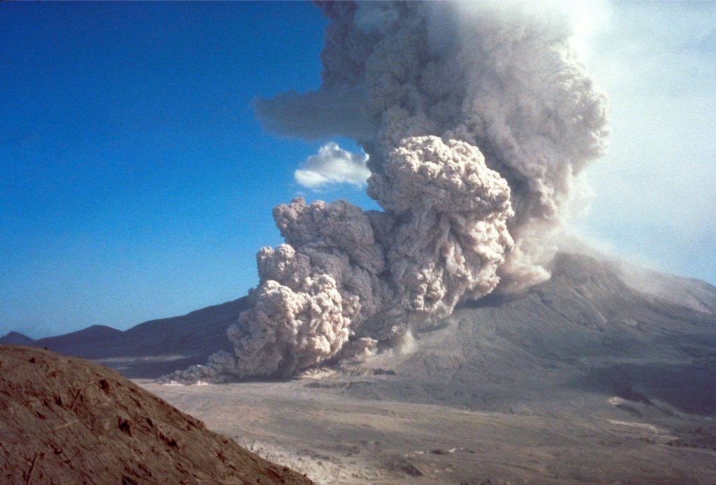 A ground-hugging pyroclastic density current and associated buoyant plume generated by column collapse at Mt St. Helens August 7, 1980, almost 3 months after the devastating eruption and lateral blast (May 18). Image credit: Peter Lipman, USGS. 