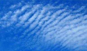 A mackerel sky, viewed from beneath – cloud waves generated by Kelvin-Helmholtz instabilities caused by shear of an overlying, fast-moving air mass over a slower moving, more dense cloud mass.