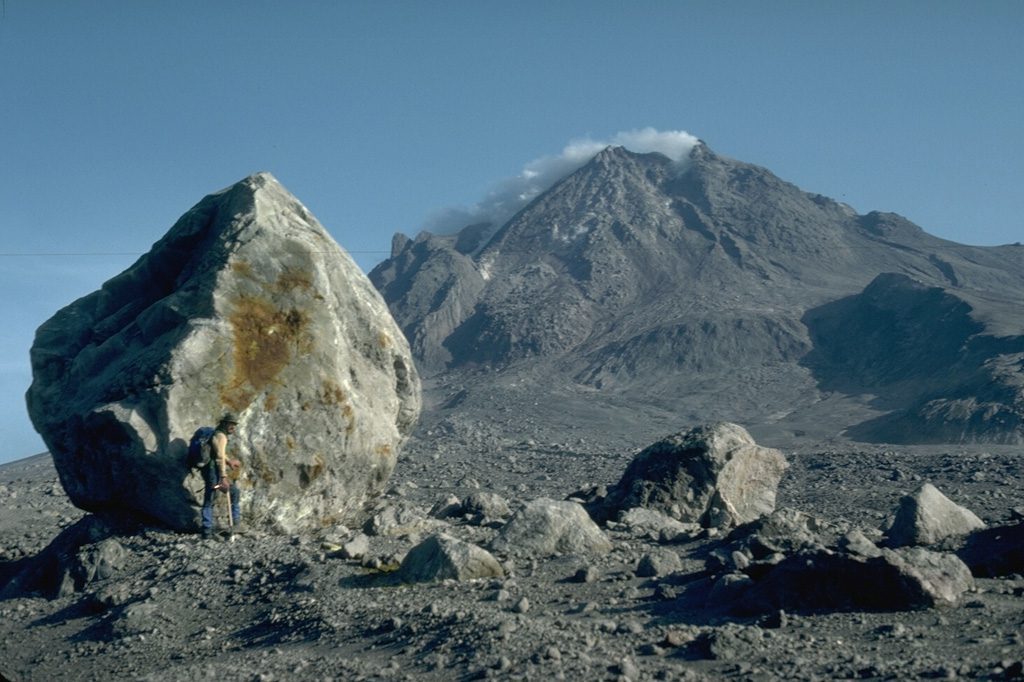 This 6 m high lava block was carried 4 km down the flank of Augustine volcano (Alaska) by a block and ash flow during the 1976 eruption. Image Credit: Harry Glicken, 1986 (U.S. Geological Survey/Smithsonian Inst.)