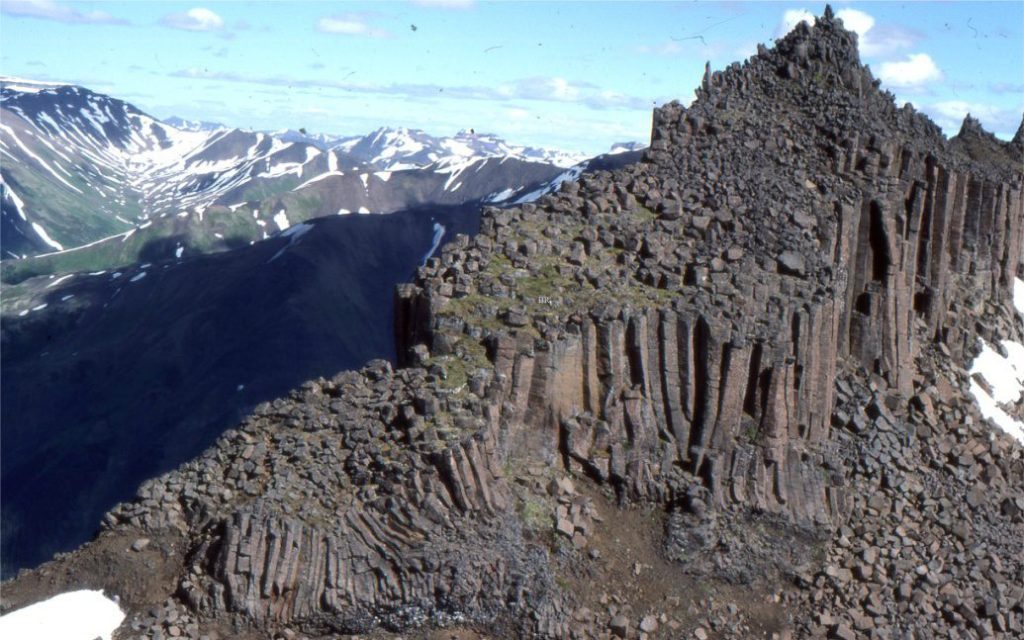The upper part of a talus fan where blocks of columnar-jointed basalt accumulate via rockfall (Category 1 in the table above). The deposit here and farther down slope has clast-supported frameworks. Polygonal clast shapes are determined by the vertical and horizontal joint patterns of lava flows. The basalt flows are part of the Edziza Volcanic Complex (northern British Columbia) and are 1-2 million years old.