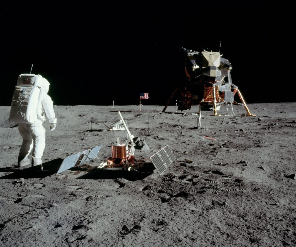 The first seismometer to be installed on a planetary body other than Earth, was at the Apollo 11 landing site on Mare Tranquillitatis. The passive seismic experiment lasted about 3 weeks. Here, astronaut Buzz Aldrin has deployed two solar panels and antenna. Several boot impressions are visible in the soft regolith soil. Image credit: NASA